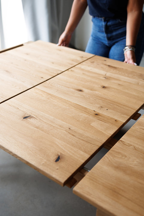 Extendable dining table 200-300x100 cm with 2 leaves in solid oak wood natural Ravello Max